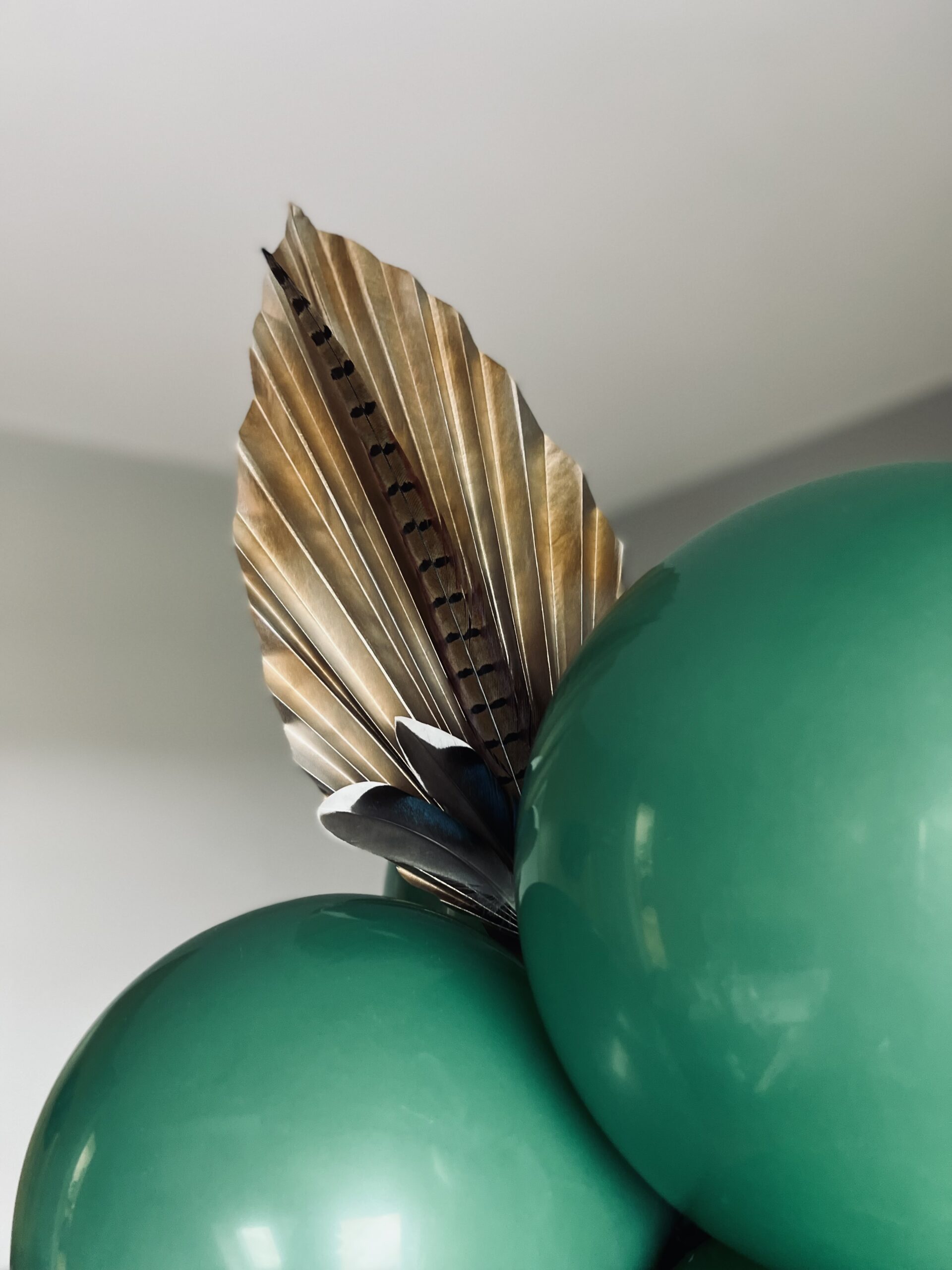Balloon plinth with props made from wild duck and pheasant feathers.