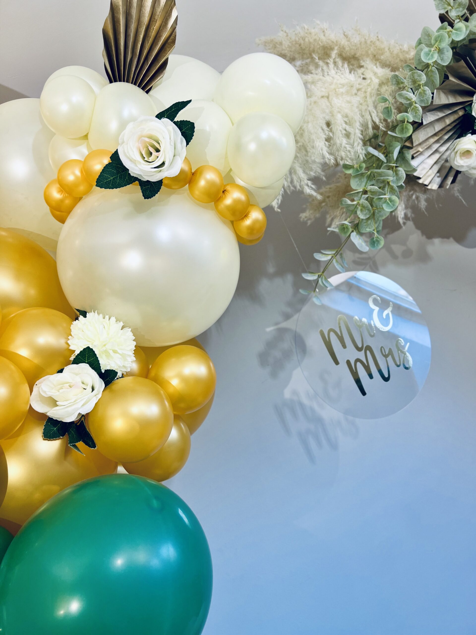 Wedding balloon arch green-gold.
